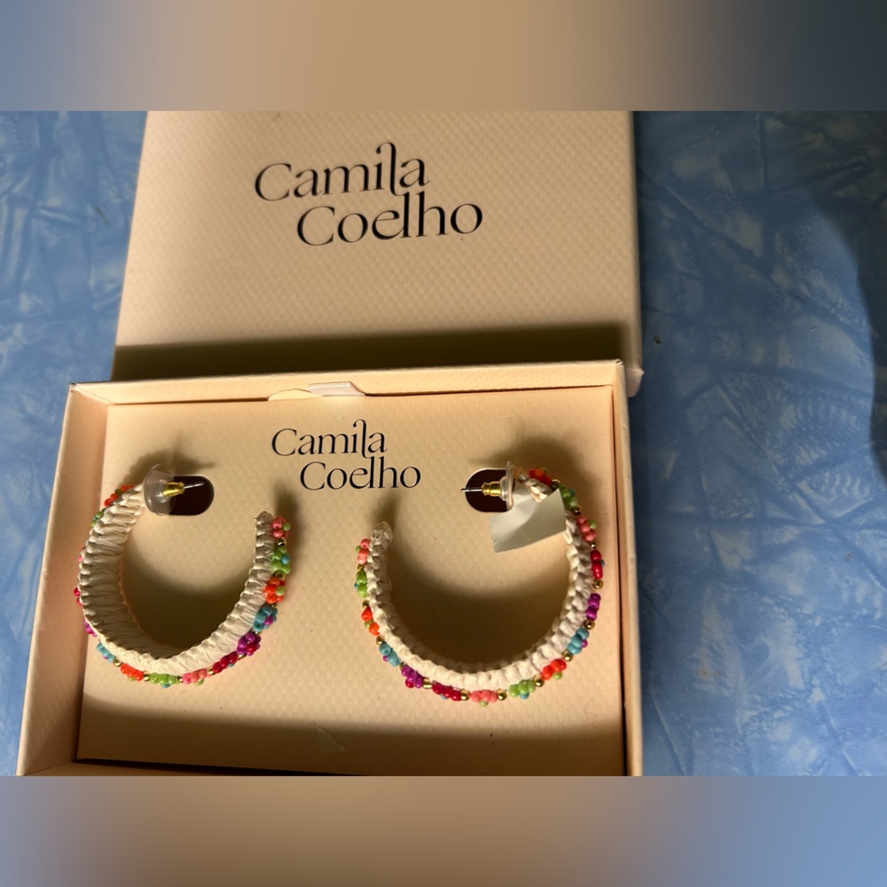 Camila Coelho earrings. White hoops with beaded flowers.